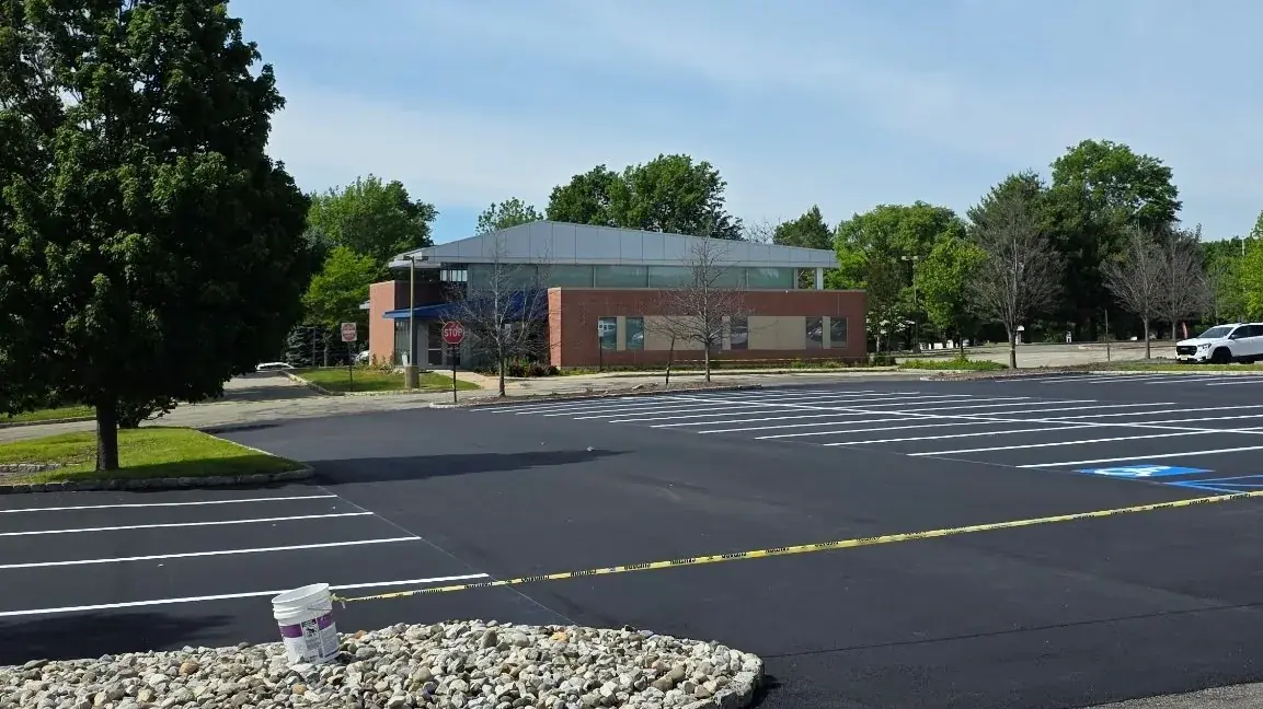 Parking lot stall markings freshly painted on new asphalt